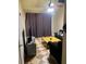 Cozy living room features checkered flooring, comfy seating, and a functional layout for modern living at 5127 Eaglesmere Dr # A02, Orlando, FL 32819
