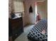 Bedroom featuring wood dresser and door to hallway at 5429 Vanderlin St, Orlando, FL 32810