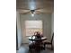Cozy dining area featuring a ceiling fan and natural light from the window at 5429 Vanderlin St, Orlando, FL 32810