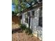 Exterior view of the side of the home showing an air conditioning unit at 5429 Vanderlin St, Orlando, FL 32810