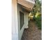 Angled exterior view showing the side of the home and yard at 5429 Vanderlin St, Orlando, FL 32810