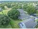 Aerial view of the community showcasing lush greenery and well-maintained homes at 3905 Westerham Dr, Clermont, FL 34711