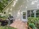 Charming back patio with a gas grill and welcome mat, perfect for outdoor entertaining at 3905 Westerham Dr, Clermont, FL 34711