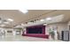 Spacious ballroom with a stage, lighting, and elegant decor, perfect for events at 3905 Westerham Dr, Clermont, FL 34711