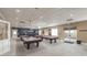 Billiards room featuring multiple pool tables, overhead lighting, and a cozy atmosphere at 3905 Westerham Dr, Clermont, FL 34711