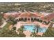 Beautiful clubhouse pool with lounge chairs and palm trees, perfect for relaxation at 3905 Westerham Dr, Clermont, FL 34711