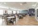 Bright dining room featuring modern tables, chairs, and stylish accents for community gatherings at 3905 Westerham Dr, Clermont, FL 34711
