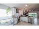 Bright, updated kitchen with stainless steel appliances and seamless access to the living area at 3905 Westerham Dr, Clermont, FL 34711