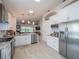 Well-lit modern kitchen with stainless steel appliances and a functional layout for cooking and entertaining at 3905 Westerham Dr, Clermont, FL 34711