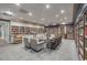 Serene library with extensive bookshelves, comfortable seating, and soft lighting at 3905 Westerham Dr, Clermont, FL 34711