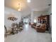 Open-concept living room with a dining area, comfortable seating, and abundant natural light at 3905 Westerham Dr, Clermont, FL 34711