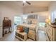 Bright and airy main bedroom featuring a ceiling fan, neutral tones, and ample natural light from a large window at 3905 Westerham Dr, Clermont, FL 34711