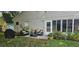Cozy outdoor patio with stylish furniture and lush landscaping, perfect for relaxing or entertaining guests at 3905 Westerham Dr, Clermont, FL 34711