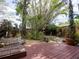 The backyard has a wood patio and mature trees offering lots of privacy at 4209 Forrestal Ave, Orlando, FL 32806