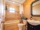 The remodeled bathroom features a tub, shower, decorative tile and vanity at 4209 Forrestal Ave, Orlando, FL 32806