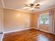 Bedroom with hardwood floors and large window allowing for natural light at 4209 Forrestal Ave, Orlando, FL 32806