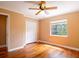 This bedroom has hardwood floors, a closet, a window, and neutral colored walls at 4209 Forrestal Ave, Orlando, FL 32806