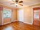 This bedroom includes hardwood floors, closet, and a large window at 4209 Forrestal Ave, Orlando, FL 32806