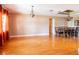 Spacious living room featuring hardwood floors, elegant chandelier, and decorative ceiling trim at 4209 Forrestal Ave, Orlando, FL 32806