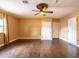 Spacious living room with hardwood floors, a ceiling fan, and plenty of natural light at 4209 Forrestal Ave, Orlando, FL 32806