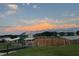 Community baseball field with covered benches under a partly cloudy sky at 17430 Se 110Th Ter, Summerfield, FL 34491