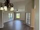 Beautiful living room with hardwood floors and natural light coming through the windows at 17430 Se 110Th Ter, Summerfield, FL 34491