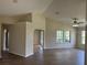 Bright living room with hardwood floors, vaulted ceiling, and plenty of natural light at 17430 Se 110Th Ter, Summerfield, FL 34491