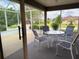 Covered patio area with ample seating to enjoy the outdoor space at 17430 Se 110Th Ter, Summerfield, FL 34491