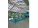 Indoor pool featuring a unique translucent overhead structure allowing for ample natural light at 17430 Se 110Th Ter, Summerfield, FL 34491