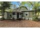 View of the home's exterior and backyard featuring neutral exterior paint and a porch at 2508 Yale Ave, Sanford, FL 32773