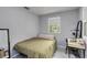 Comfortable bedroom with a window, desk, and space-saving design for a productive environment at 2508 Yale Ave, Sanford, FL 32773