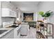 Functional kitchen open to the living area, featuring granite countertops and modern appliances at 2508 Yale Ave, Sanford, FL 32773