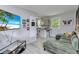 Cozy living room connected to a modern kitchen with comfortable seating and contemporary decor at 2508 Yale Ave, Sanford, FL 32773