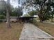 Charming single-story home with a covered carport and spacious front yard at 725 6Th Ne St, Fort Meade, FL 33841
