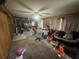 Spacious living room with neutral carpet, wood paneling and ample natural light at 725 6Th Ne St, Fort Meade, FL 33841