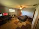 Cozy bedroom with unique carpeting, a ceiling fan, a computer desk, and bright natural lighting at 1818 Mango Tree Dr, Edgewater, FL 32132