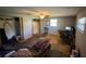 Spacious bedroom features a ceiling fan, closet, and a dedicated desk area for work or hobbies at 1818 Mango Tree Dr, Edgewater, FL 32132