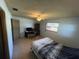 Well lit bedroom featuring desk area, ceiling fan, and large windows that add warm natural light at 1818 Mango Tree Dr, Edgewater, FL 32132