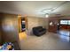 Spacious living room with neutral walls and a comfortable sofa, creating a relaxing ambiance at 1818 Mango Tree Dr, Edgewater, FL 32132