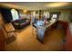 Spacious Gathering room with a fireplace, creating a cozy atmosphere perfect for relaxation and entertainment at 1818 Mango Tree Dr, Edgewater, FL 32132