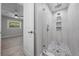 Modern bathroom shower with elegant tile work and glass doors at 219 Vermont Ave, St Cloud, FL 34769