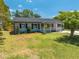 Charming single-story home featuring a well-maintained lawn and inviting front porch at 219 Vermont Ave, St Cloud, FL 34769