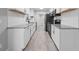 Modern kitchen features stainless appliances, granite countertops, subway tile backsplash, and woodgrain flooring at 219 Vermont Ave, St Cloud, FL 34769