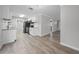 Well-lit kitchen with white cabinetry, modern appliances, and a view to the living room at 219 Vermont Ave, St Cloud, FL 34769