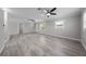Bright living room featuring hard surface floors, ceiling fans, and windows at 219 Vermont Ave, St Cloud, FL 34769