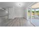 Bright sun room featuring hard surface floors and view to the backyard at 219 Vermont Ave, St Cloud, FL 34769