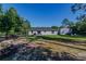 Landscaped backyard featuring a lovely patio space and green grass at 9085 Sw 202Nd Avenue Rd, Dunnellon, FL 34431