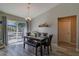 Bright dining area features backyard views and blends into kitchen space at 9085 Sw 202Nd Avenue Rd, Dunnellon, FL 34431