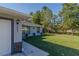 Side view of house showcasing the landscaped yard and design, highlighting the property's features at 9085 Sw 202Nd Avenue Rd, Dunnellon, FL 34431