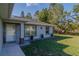 Well-kept home exterior with tidy landscaping and a welcoming front entrance at 9085 Sw 202Nd Avenue Rd, Dunnellon, FL 34431